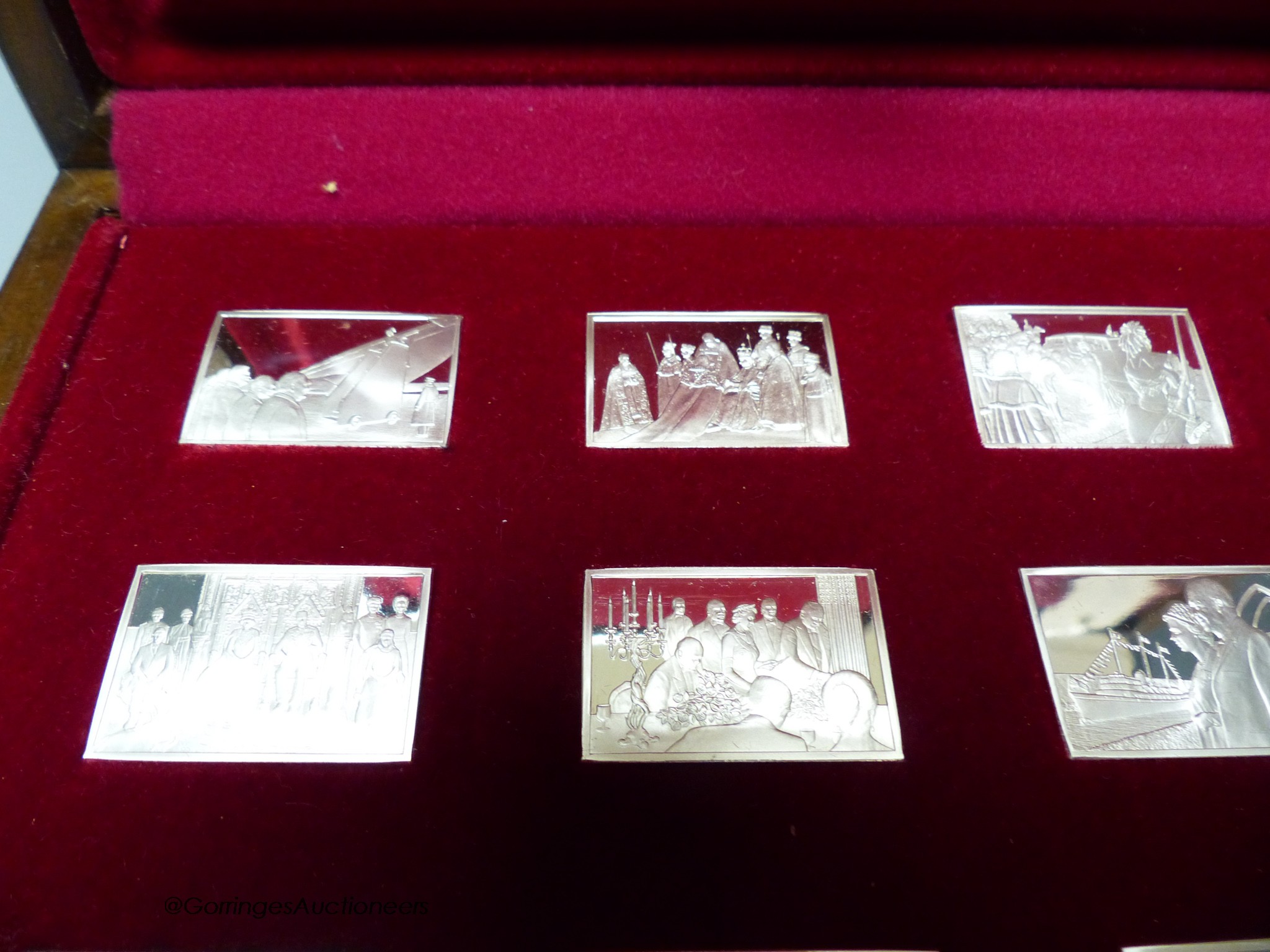 A cased set of twenty five John Pinches 'Elizabeth Our Queen' commemorative silver ingots and one other set of '100 Greatest Cars' miniature silver ingots.